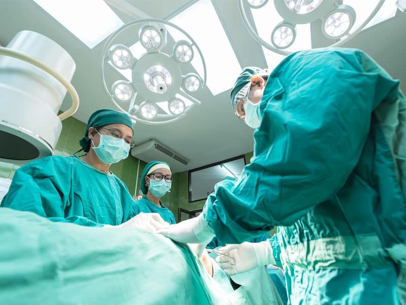 surgery in progress to illustrate a well-run operating room